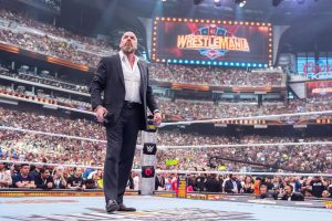 Triple H standing promoting WrestleMania 42 Returns