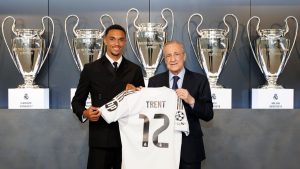 Trent Alexander-Arnold with Florentino Pérez holding real madrid number 12 jersey
