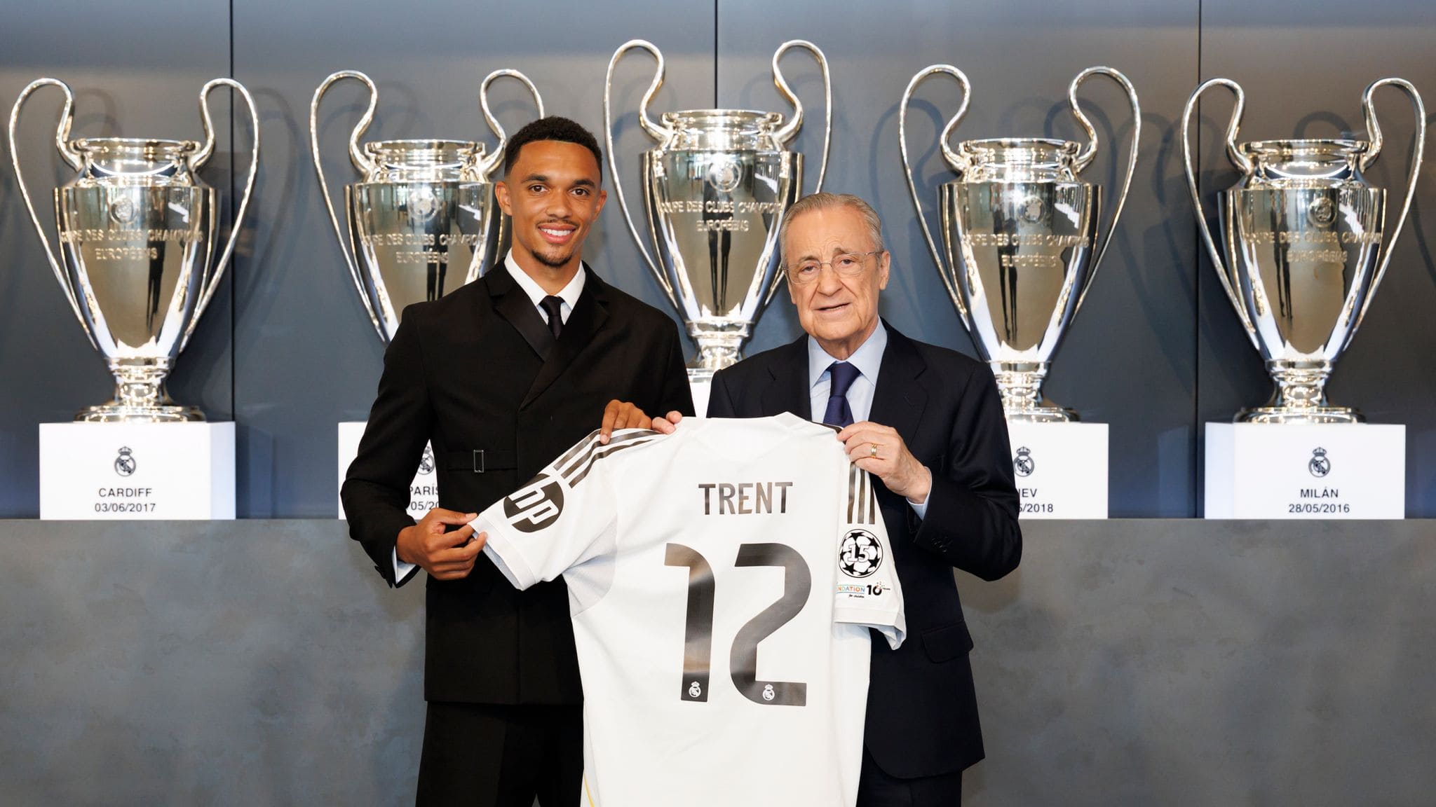 Trent Alexander-Arnold with Florentino Pérez holding real madrid number 12 jersey